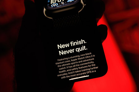 Paris, France - Sep 8, 2024: Male hand holding the iPhone 16 Pro Max displaying the new Apple Watch Ultra 2 in titanium, featuring the slogan Never Finish, Never Quit. The ultimate sport and adventure watch, designed with a durable titanium case, set agaiのeditorial素材