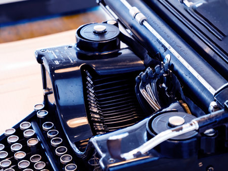 Detailed close-up of an antique typewriter, showing the mechanical keys and typebars, highlighting vintage technology and craftsmanship in writing equipmentの写真素材