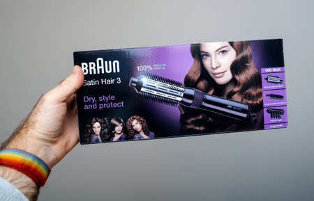 Paris, France - Dec 24, 2023: Box for Braun Satin Hair 3 styling brush showcasing ceramic coating and styling attachments. This 400-watt hair tool is designed for professional and home useのeditorial素材