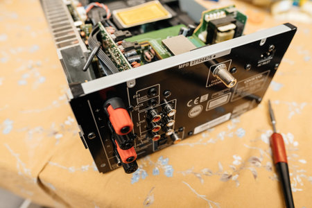 Paris, France - Feb 8, 2023: Close-up of the back panel of an Onkyo amplifier, displaying various...