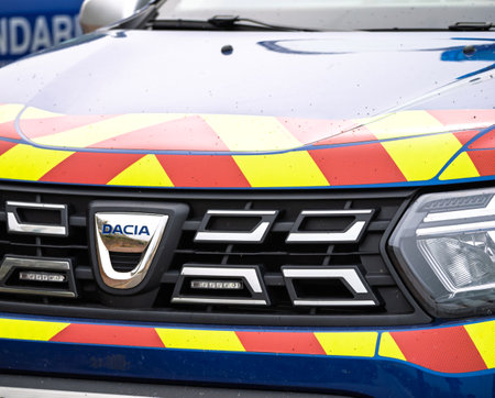 Hardelot, France - Aug 21, 2023: Close-up of a Dacia Gendarmerie vehicle in France, featuring distinctive red and yellow reflective safety markings on the hoodのeditorial素材