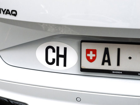 Basel, Switzerland - Sep 8, 2024: Basel, Switzerland - Sep 8, 2024: Close-up of a Swiss car license plate with the national CH sticker and canton emblem, spotted in Basel, Switzerland, on a white Skoda vehicleのeditorial素材