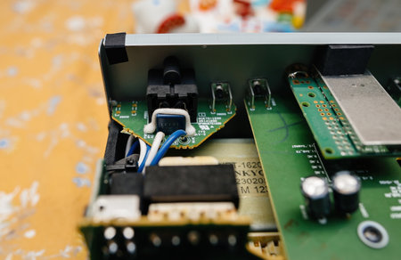 Paris, France - Feb 8, 2023: A detailed close-up of the internal circuitry of an Onkyo CD player, highlighting capacitors and connections essential for audio performanceのeditorial素材