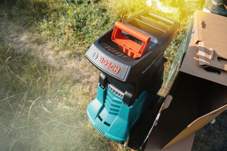 Paris, France - Jul 18, 2020: Close-up of a Bosch garden shredder featuring the Turbine Cut System,...