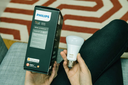 Paris, France - Aug 16, 2020: A close-up of the Philips Hue White Ambiance Starter Kit packaging, featuring a smart bulb, highlighting its features for creating personalized lighting experiencesのeditorial素材