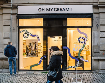 Strasbourg, France - Nov 29, 2024: Bright Oh My Cream storefront featuring festive holiday designs...