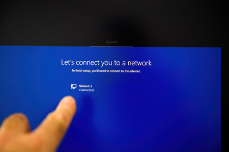 Paris, France - Nov 25, 2020: Blue screen showing network setup instructions with a connected network and a finger pointing at the displayのeditorial素材