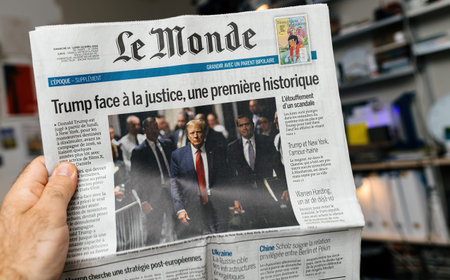 Paris, France - May 20, 2024: Le Monde newspaper front page highlights Donald Trump facing justice,...