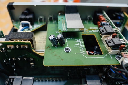 Frankfurt, Germany - Feb 8, 2023: A close-up view of the internal components of a hi-fi amplifier, featuring intricate circuitry, capacitors, and high-quality wiringの写真素材