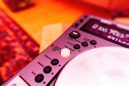 Image of a professional DJ's equipment featuring buttons like Tap, Echo Loop, Flanger, Filter, Disk Mode, Scratch, and Brakeの写真素材