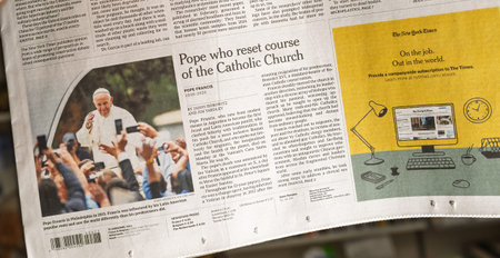 Paris, France - Apr 22, 2025: Close-up of The New York Times article titled Pope who reset course of the Catholic Church featuring Pope Francis and mourning readers holding smartphonesのeditorial素材