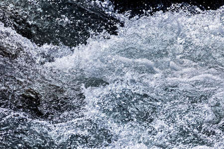 Sparkling water of a mountain streamの写真素材