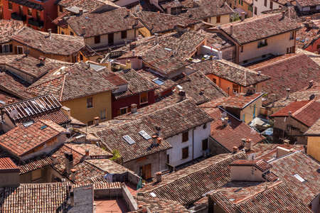 seen from above of the roofs of a medieval town with terracotta tilesの写真素材
