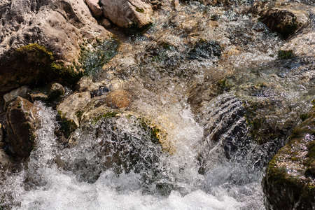 sparkling water of a mountain streamの写真素材