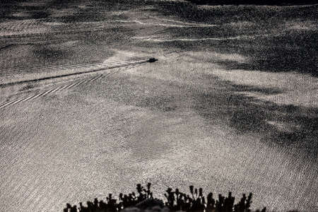 view from above of the Lake Garda with the water trail left by ferryの写真素材