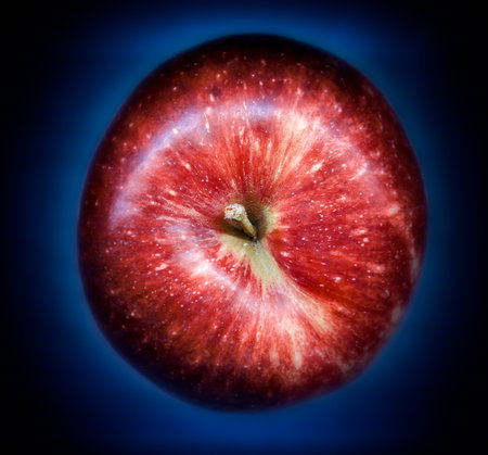 red apple on blue gradient background