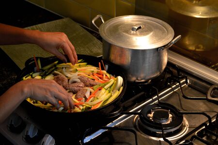 Cooking healthy food at home in coronavirus COVID 19 quarantineの写真素材