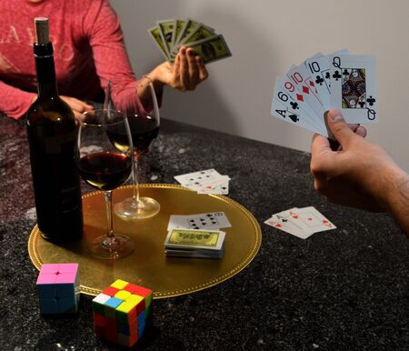 A good wine and a card game in the quarantine for the coronavirus COVID 19の写真素材