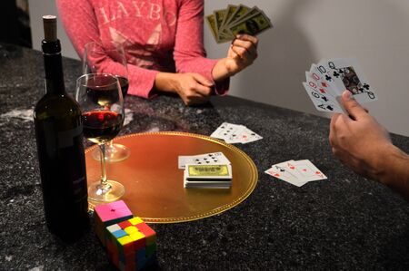 A good wine and a card game in the quarantine for the coronavirus COVID 19の写真素材