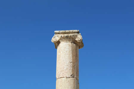 The Oval Plaza collumn isolated on blue sky; the great Roman city of Jerash - Gerasa, located in Jerash city in Jordanの写真素材