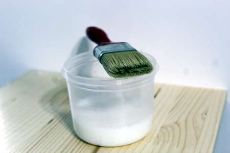 Paint brush with water based colorless lacquerの写真素材