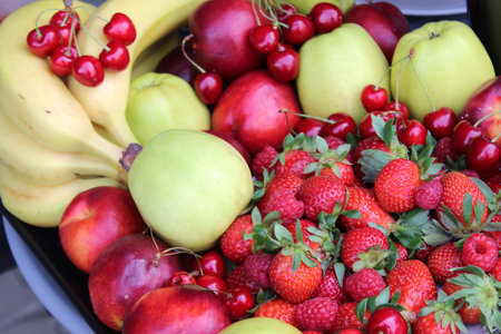 Mix of fruits: apple, nectarine, bannanas, strawberry, cherryの写真素材