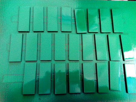 Green Painted Wooden Blocks Drying â Industrial Coating Processの写真素材