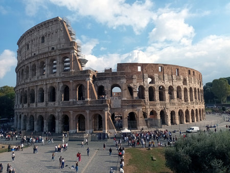 Panoramic View of the Roman Colosseum in Daylight with Touristsの写真素材