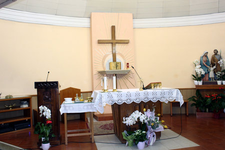 Interior of Adoration Chapel in Medjugorje with altar and flowersの写真素材