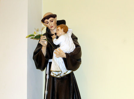 Statue of Saint Anthony of Padua holding baby Jesusの写真素材