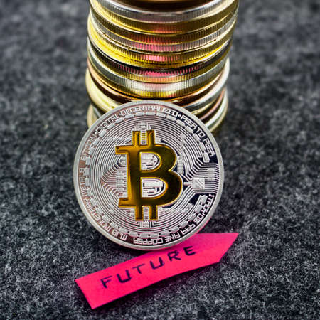 Cryptocurrency physical silver bitcoin coin and future pink arrowの写真素材