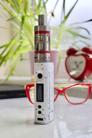 Old white and silver electronic vaporizerの写真素材