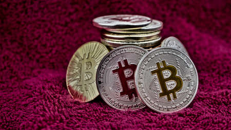 Digital currency physical bitcoin coins in pink sceneのeditorial素材