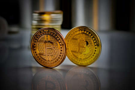Digital currency brass and gold bitcoin coins.の写真素材