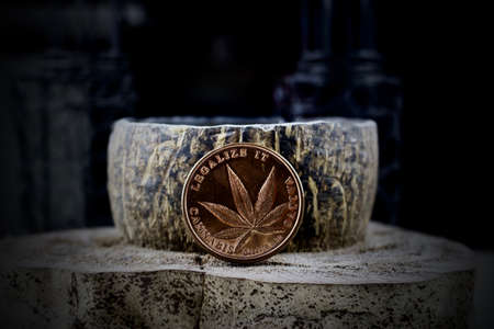 Brass physical coin legalize it, cannabis, sativa.の写真素材
