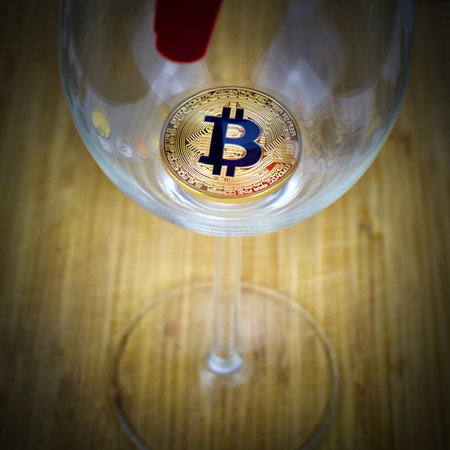 Cryptocurrency physical gold bitcoin in glass. Faucet.