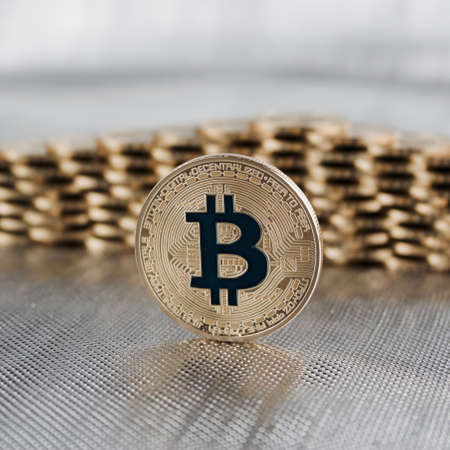 Cryptocurrency physical gold bitcoin coin. Money concept.のeditorial素材