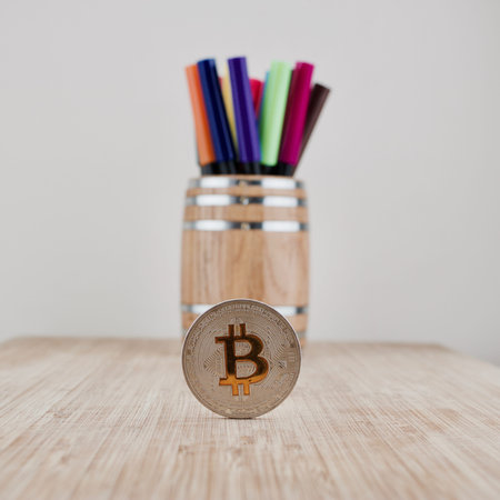 Digital currency physical silver bitcoin coin near wooden barrel.の写真素材