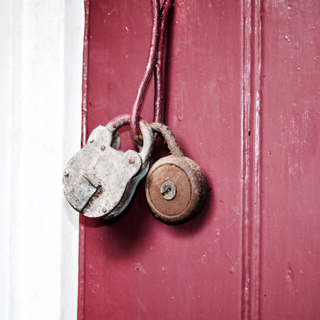 Two old and dirty lockers on the red doors. Village fashion in the garden.の写真素材