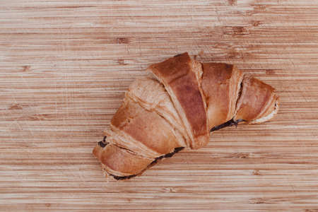 Delicious and fresh twirl with chocolate on the wooden board. Food concept.の写真素材