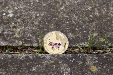 Europe leaving. Gold brexit coin with british map. United Kingdom, article 50.の写真素材