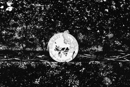 Europe leaving. Silver brexit coin in black, dark background.の写真素材