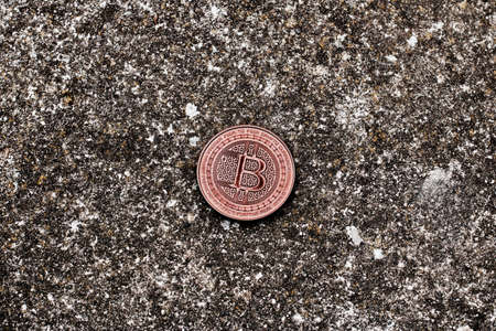 Digital currency physical bitcoin coin on the dark background.の写真素材