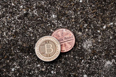 Digital currency physical bitcoin coin on the dark background.の写真素材