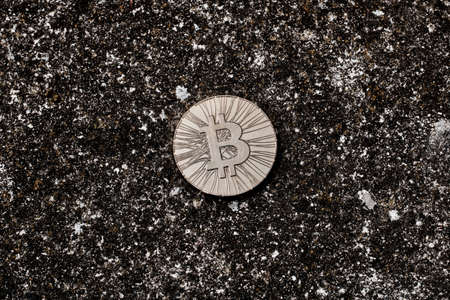 Digital currency physical bitcoin coin on the dark background.の写真素材