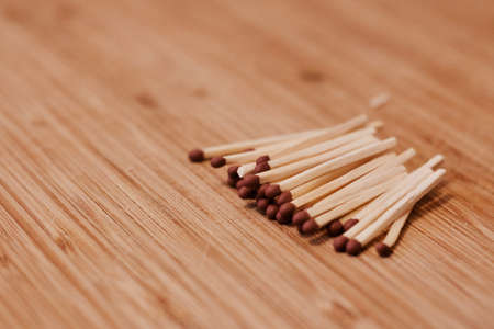 Brown small matches on the wooden board. Close-up photography. Wooden concept.の写真素材