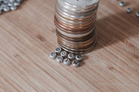 Digital currency doge coin inscription on the wooden board. Separate silver letters.の写真素材