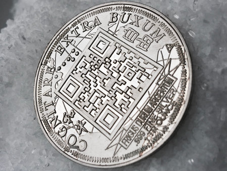 Digital currency physical metal coin on the white cristal background. Virtual cash concept.