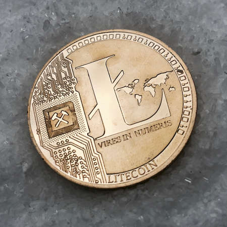 Digital currency physical metal coin on the white cristal background. Virtual cash concept.の写真素材