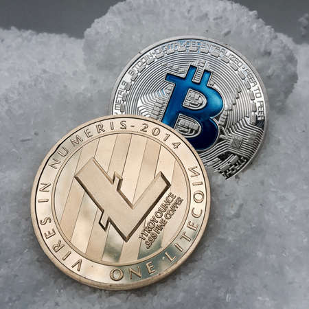 Digital currency physical metal coin on the white cristal background. Virtual cash concept.の写真素材